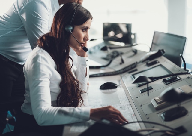 aviation-dispatchers-woman-mic-controlling