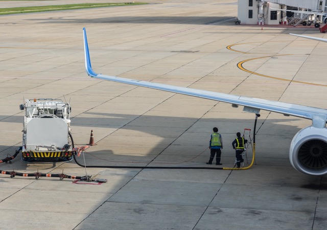 two-men-standing-in-the-airport-who-do-the-fueling-services